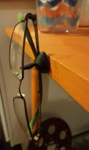 Glasses held in place at the edge of a table